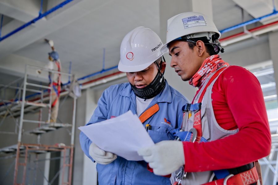 Construction workers in PPE on a large infrastructure project